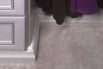 Decorative Molding in Antique White Closet Used as Baseboard Trim