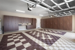 Coco-Garage-Cabinets-with-Swiss-Trax-Tile-Floor-Wide-Angle