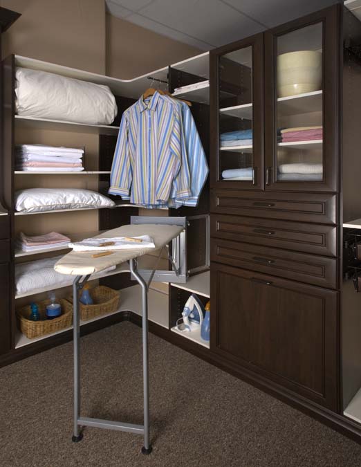 Linen closet with dlx. ironing board in Silver Mist finish. Closet in Chocolate Pear and White melamine finishes